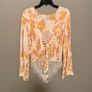 Free people floral body suit with deep v